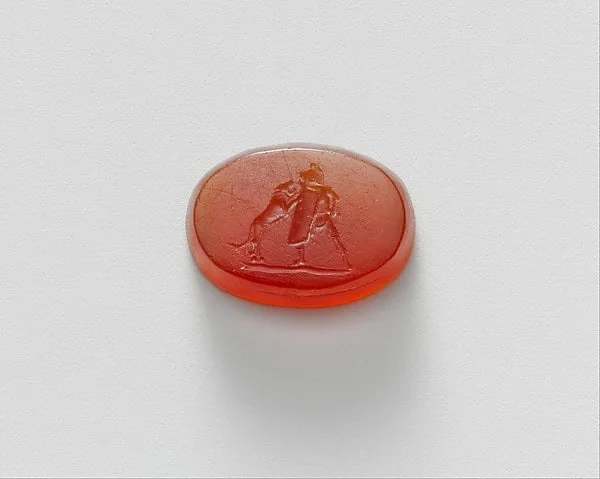 Carnelian intaglio of a gladiator fighting a lion